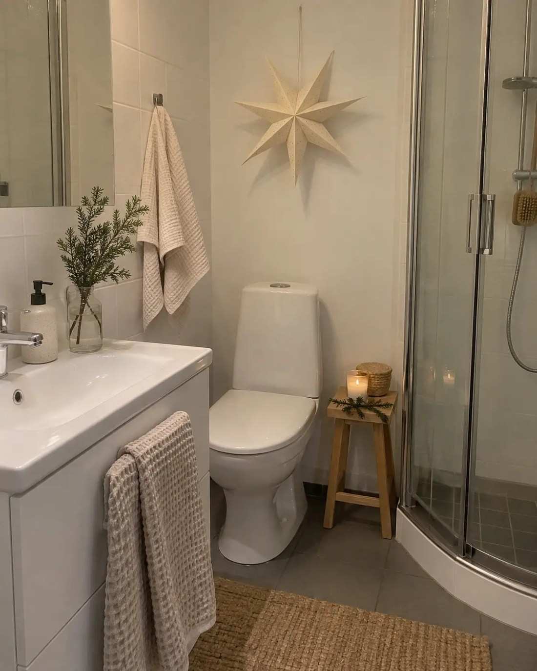 White and wood bathroom, simple greenery, bright lighting, minimalist holiday style
