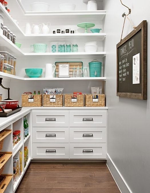 Corner pantry shelf with a spinning bamboo Lazy Susan, organized condiments, wood accents.