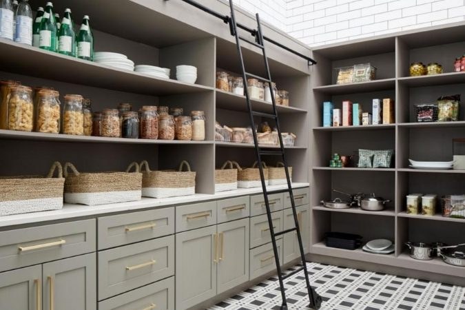 Pantry door painted with chalkboard paint, hand-written labels, wood trim, warm interior lighting.