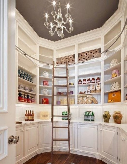 Pantry shelves with integrated sliding wire drawers, white finish, organized baking goods, bright lighting.
