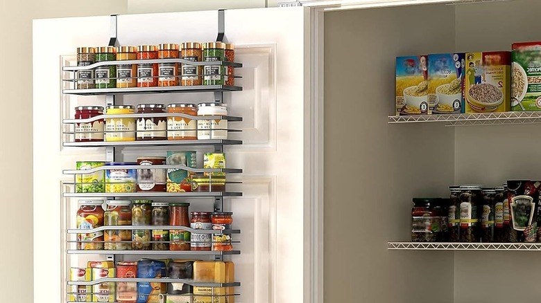 Pantry organization ideas featuring high-end custom cabinetry with integrated task lighting and drawers.