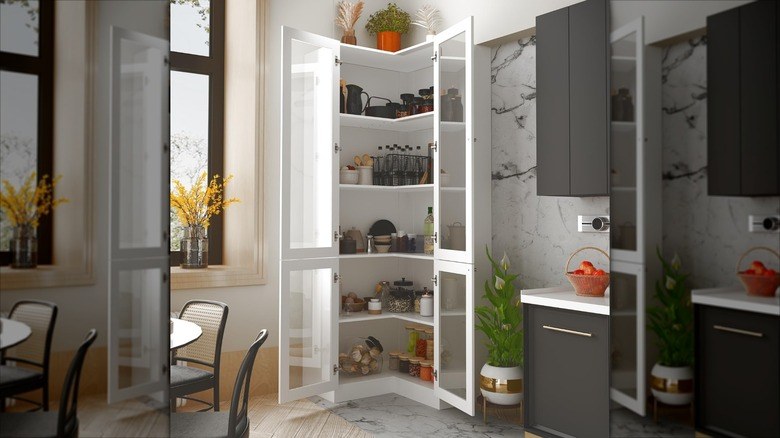 Pantry organization ideas with containers grouped by color-coded lids on a white shelf.