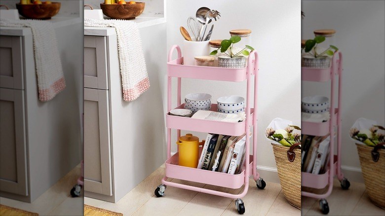 Pantry organization ideas featuring a built-in roll dispenser for foil, plastic wrap, and paper towels.