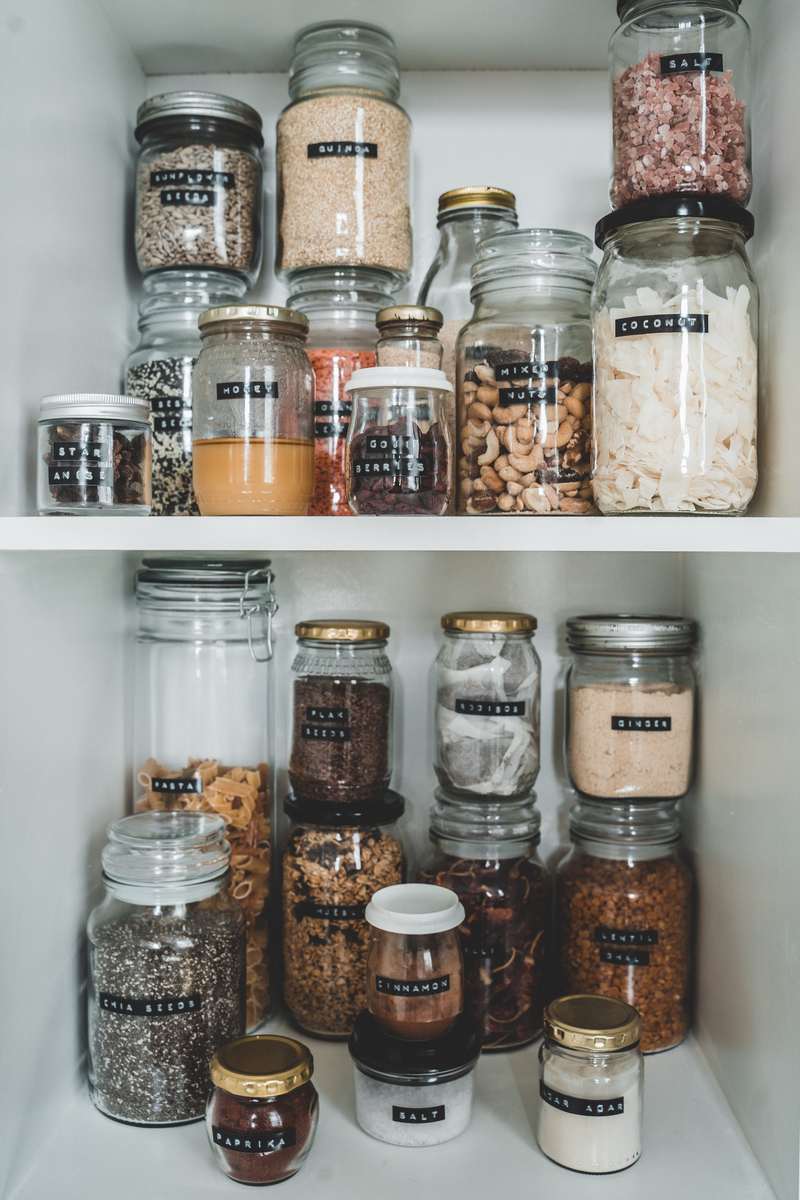 Pantry organization ideas with flexible, adjustable metal track shelving that adapts to container sizes.