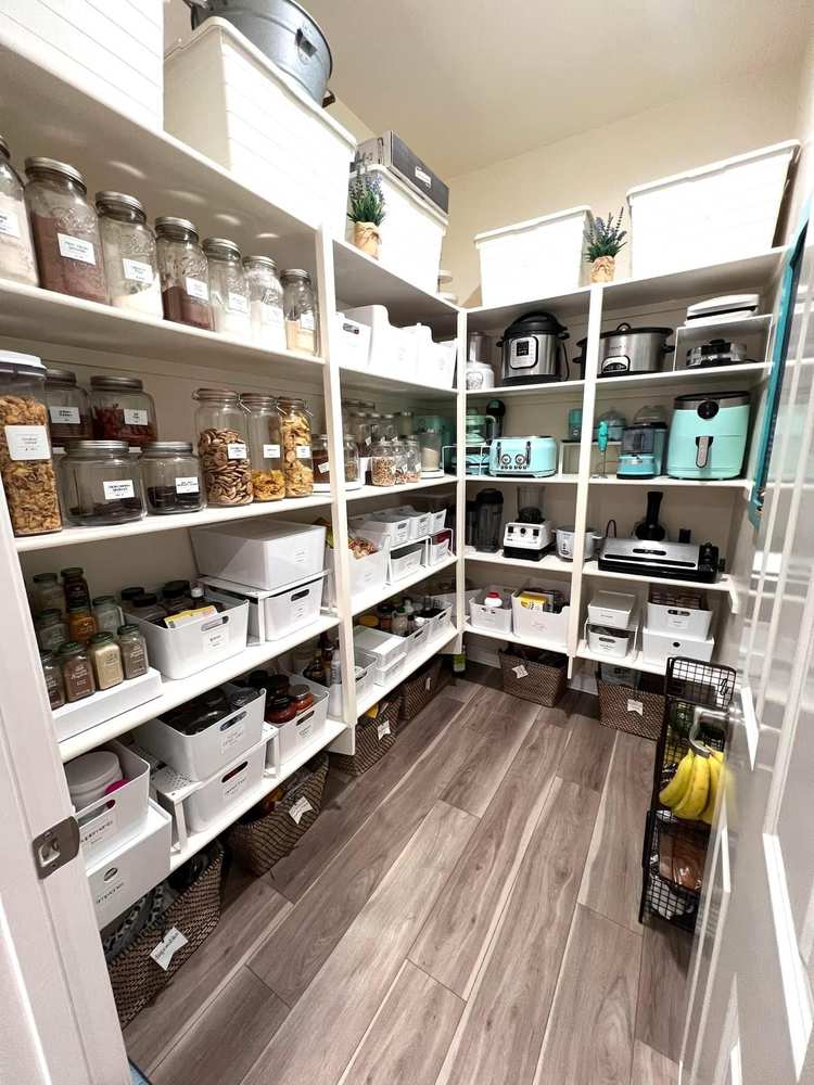 Pantry organization ideas with metal hanging baskets attached to the bottom of existing shelves.