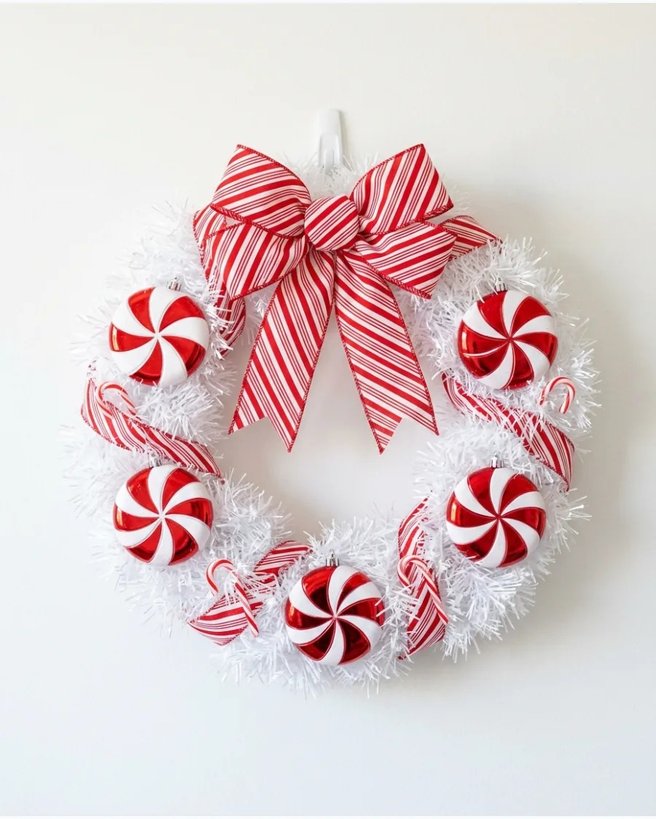 Peppermint wreath on white door with red and white stripes