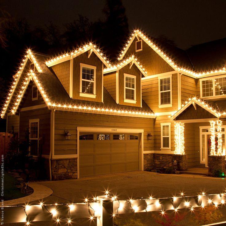Dark green christmas light cord visually ruining snowy white flocked pine garland decor.