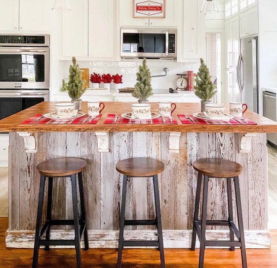 Plaid table runner and napkins arranged on the kitchen island for a casual dining setup.