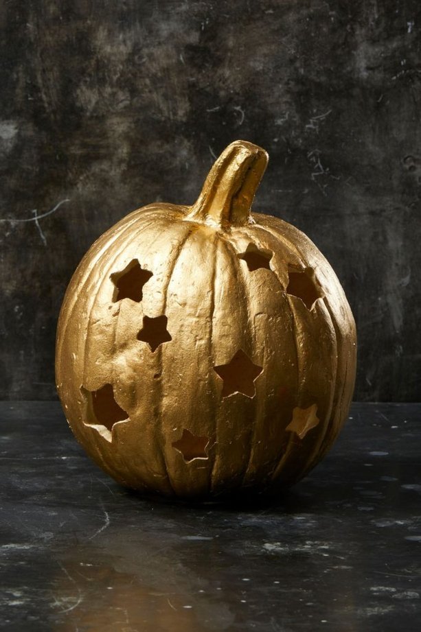 Mudroom bench with a group of pumpkins, varied sizes, rustic textures.