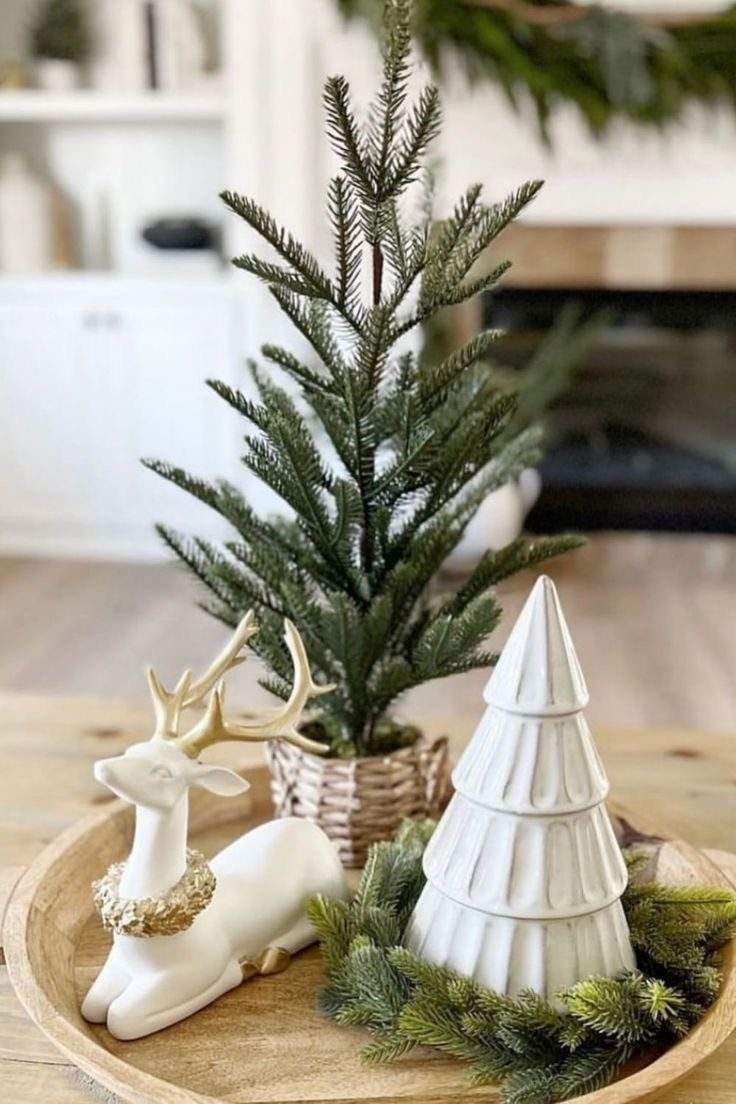 Christmas coffee table decor showcasing abundant red winter berries, fresh pine, and glowing tea lights.