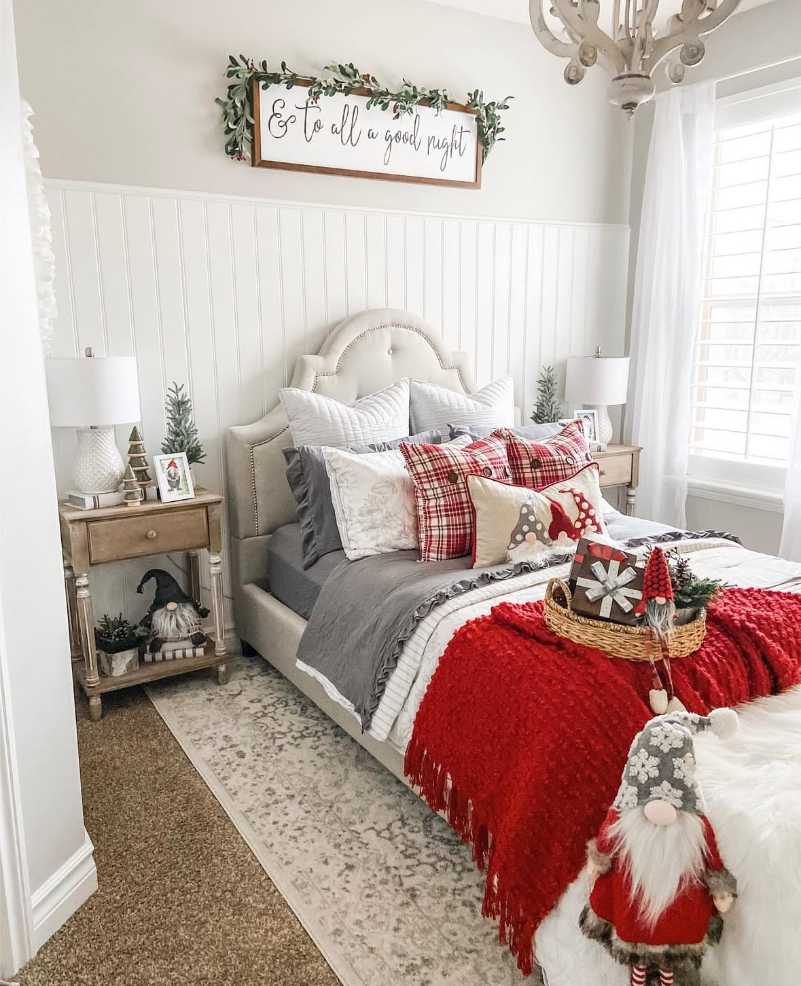 Nightstand with red plaid tray, cocoa mugs, and warm lighting for a cozy feel.