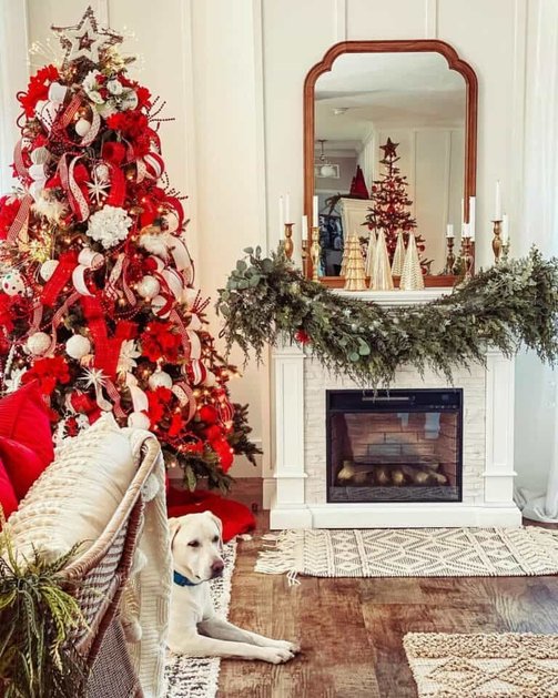 Bright living room featuring billowed ribbon garland tree beside bouclé armchair in daylight