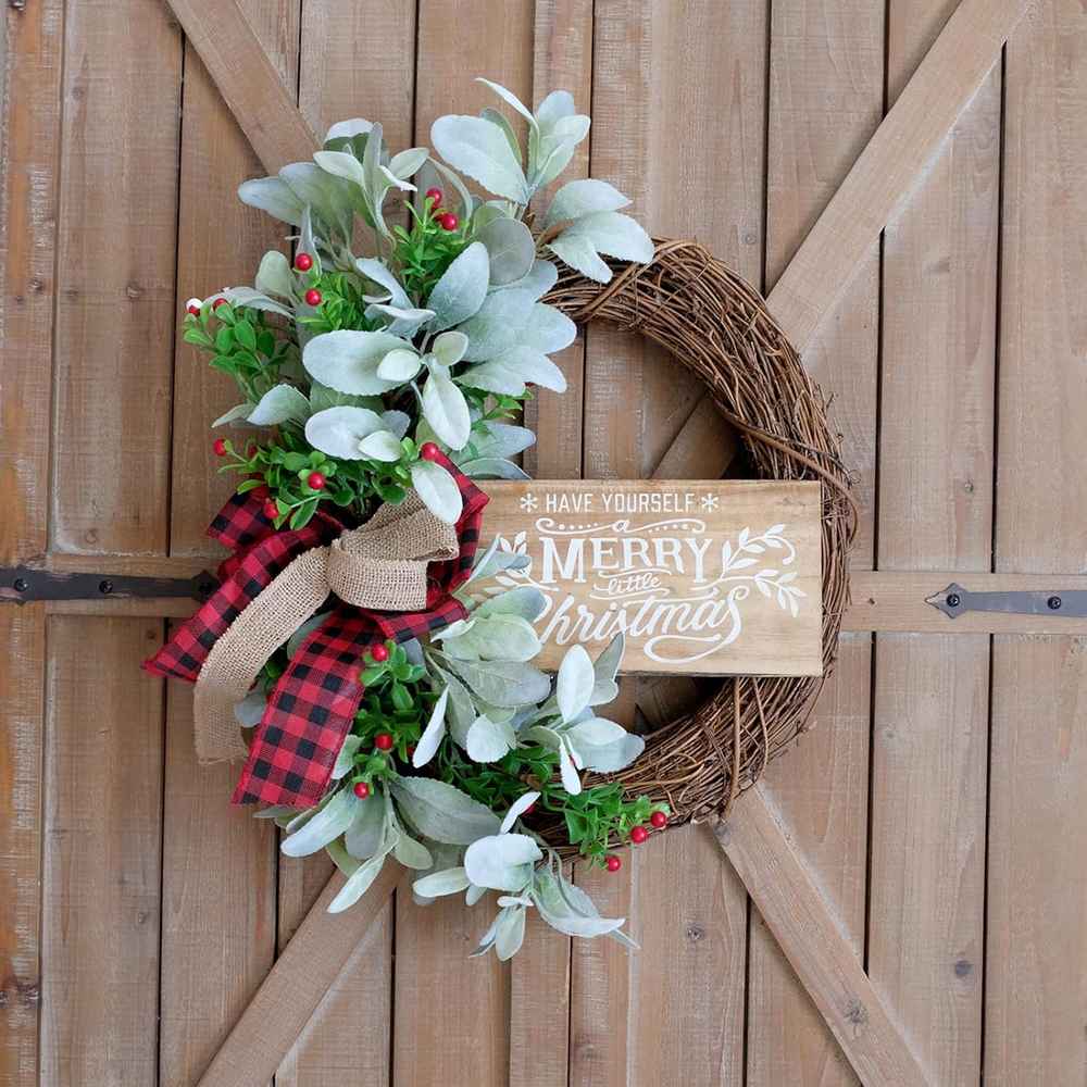 Farmhouse style wreath with buffalo check ribbons and raw wood accents.