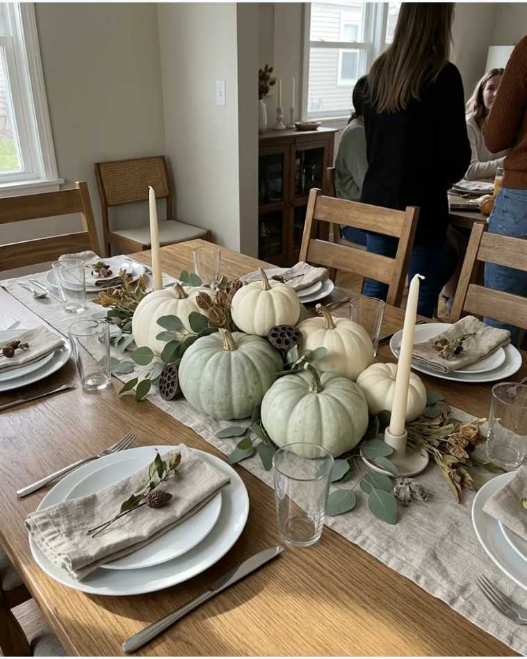 Sage green and white heirloom pumpkins on a runner
