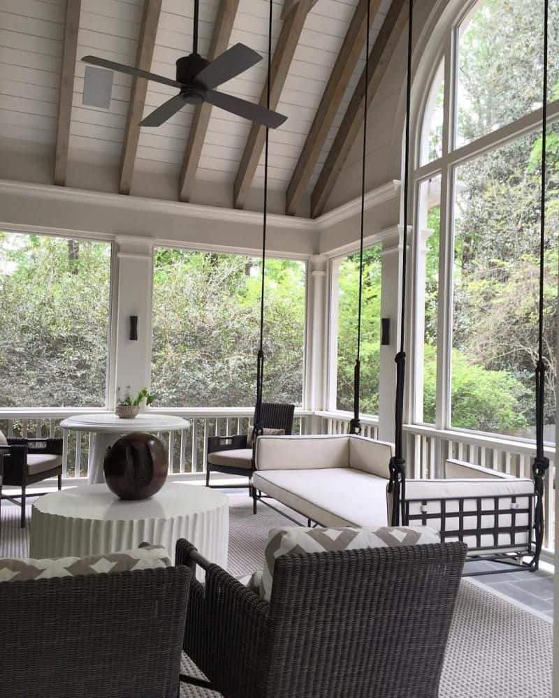 Screened in porch ideas white swing daybed ceiling fan featuring a dreamy coastal aesthetic.