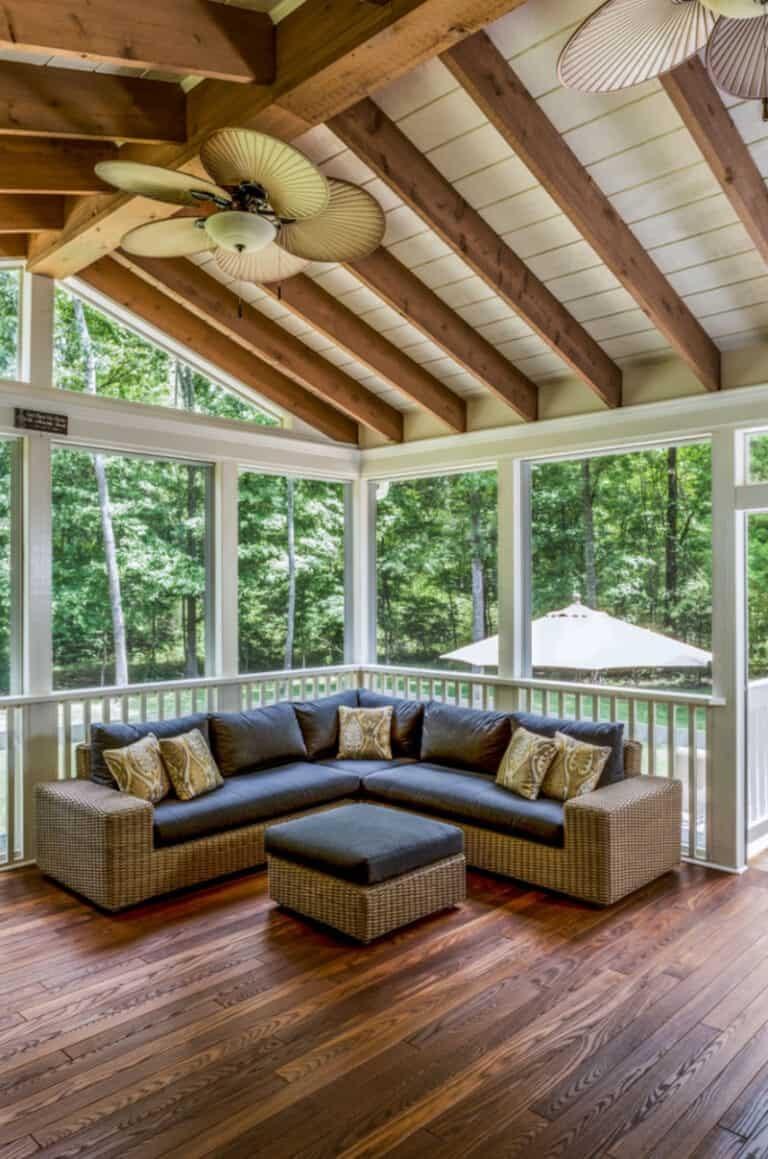Screened in porch ideas wicker sectional fans beams creating a spacious outdoor living room.