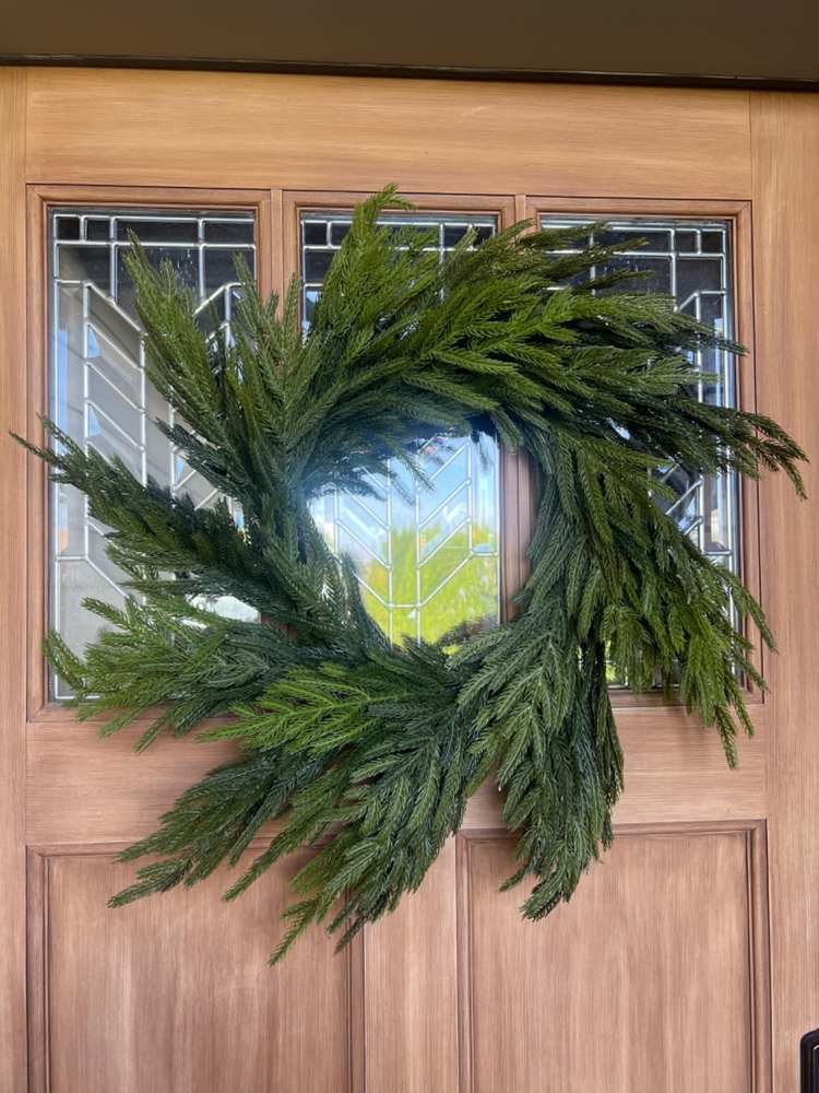 A clean, minimalist wreath featuring only high-quality evergreen boughs.