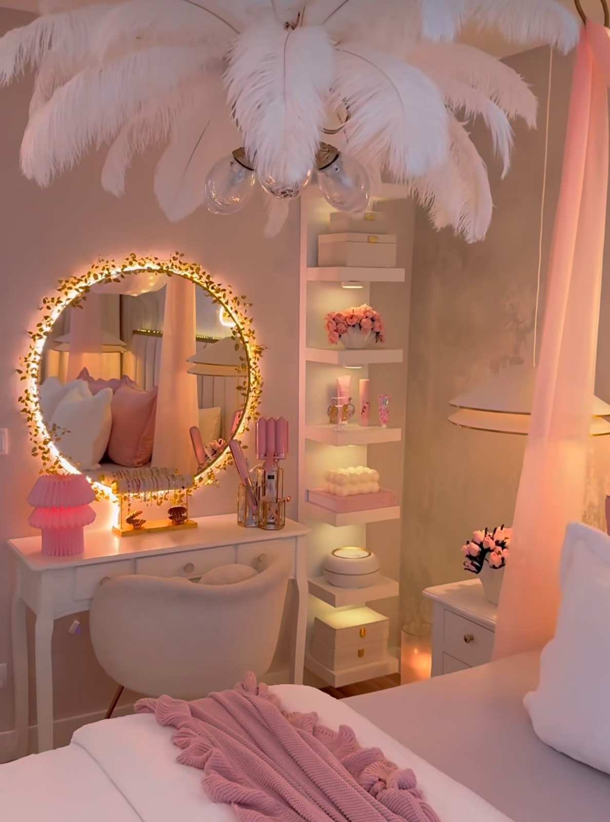 Small bedroom decor with a feather chandelier hanging over a small vanity table