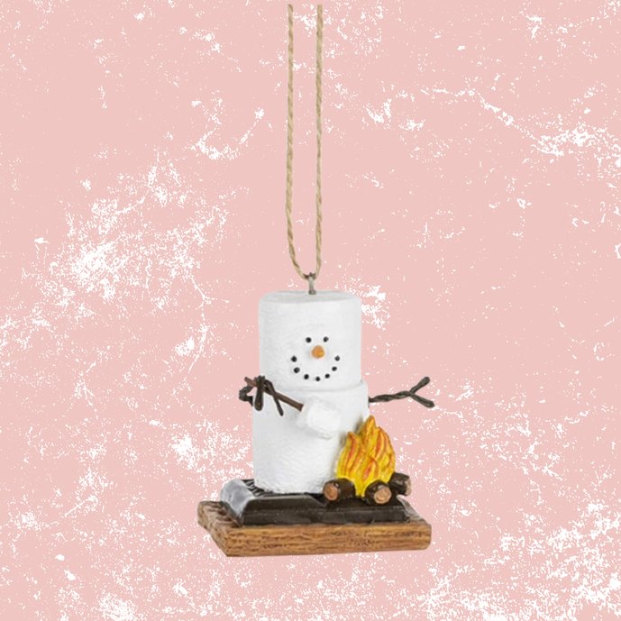 Cute smores snowman ornament hanging from a pine branch with graham cracker and marshmallow details.