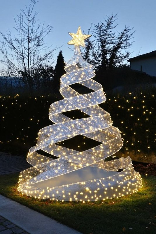 Modern front yard showcasing a cone spiral Christmas tree made of glowing LED rope lights.