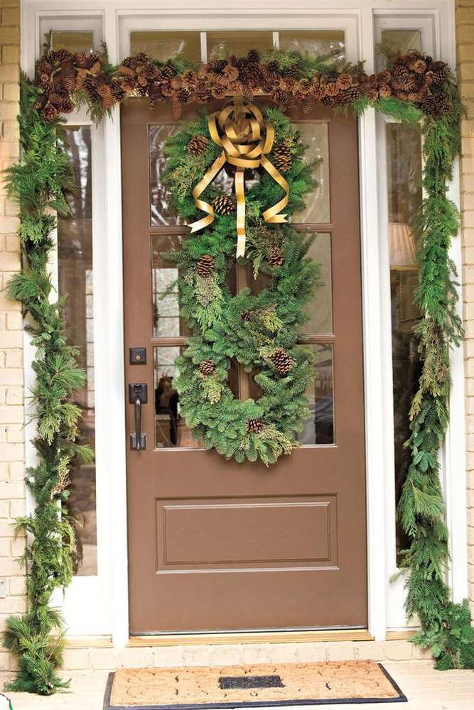 A thick, lush wreath featuring stacked pine branches and natural pinecones.