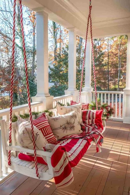 Front porch swing with striped cushions, wooden frame, pastel tones, warm lighting