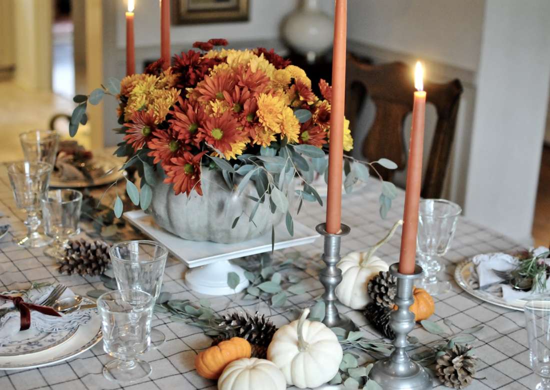 Deep green boxwood garland featuring gold leaf painted pears and crystal floating candle bowls.
