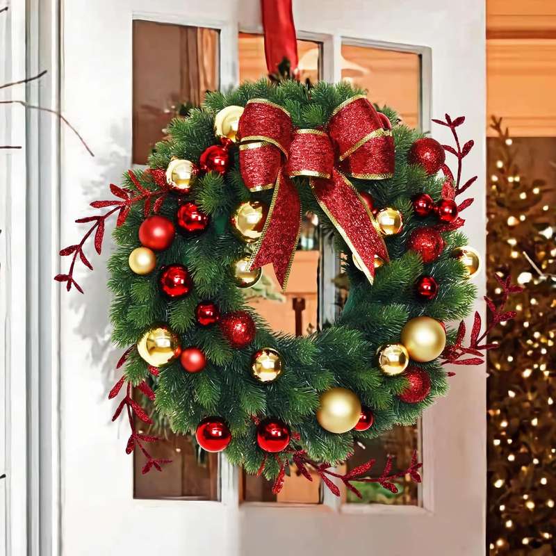 Classic holiday wreath with traditional red and gold baubles and greenery.