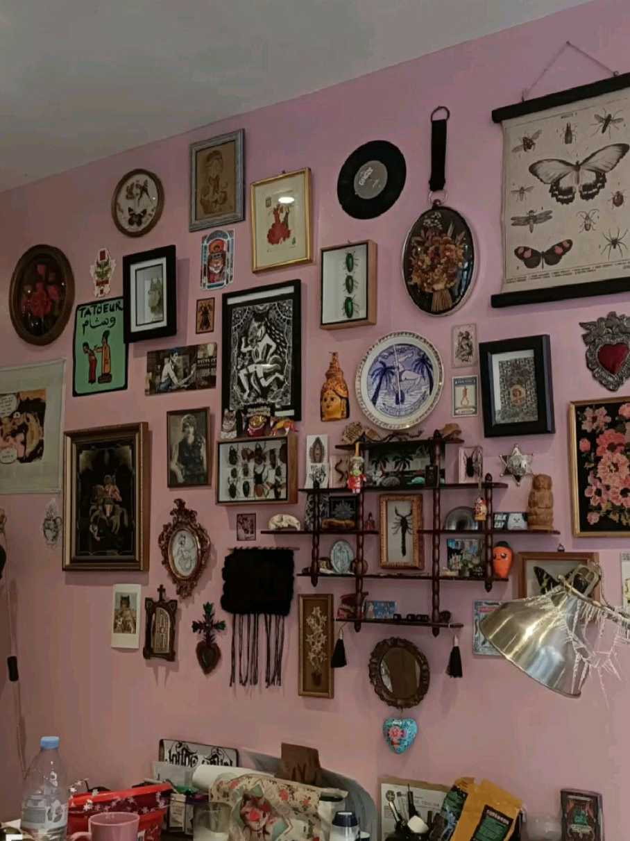 Wall of vintage oddities and curios in a eclectic, antique-filled room.