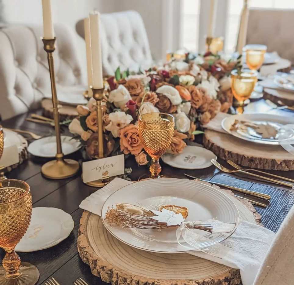Glamorous dining, amber glassware set, dark velvet tablecloth, gold candlesticks, low warm lighting