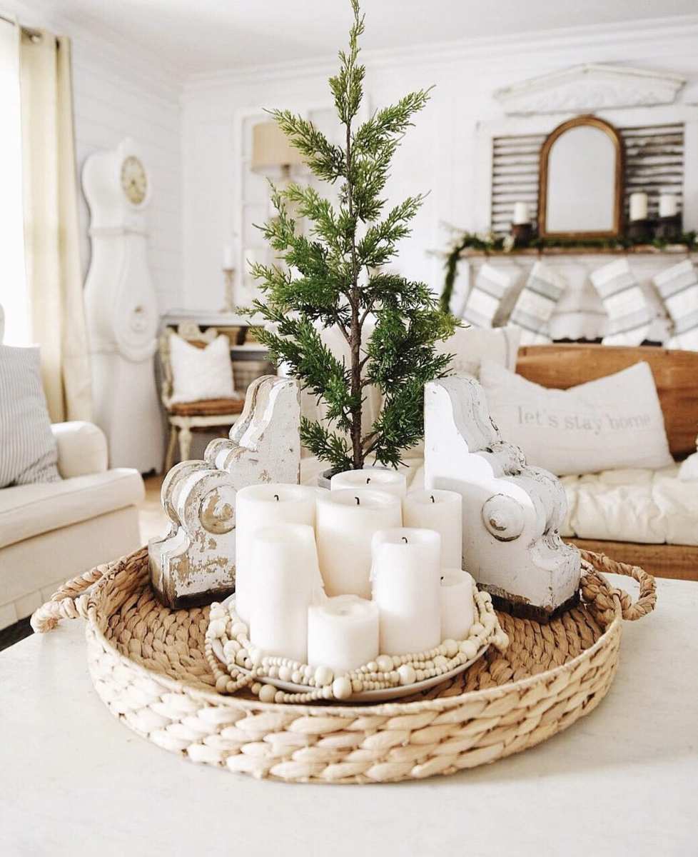 Complete winter village Christmas coffee table decor featuring snow-dusted mini trees and tiny glowing houses.
