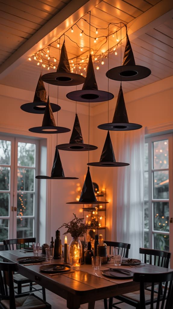 Chandelier made of witch hats and fairy lights in a living room.