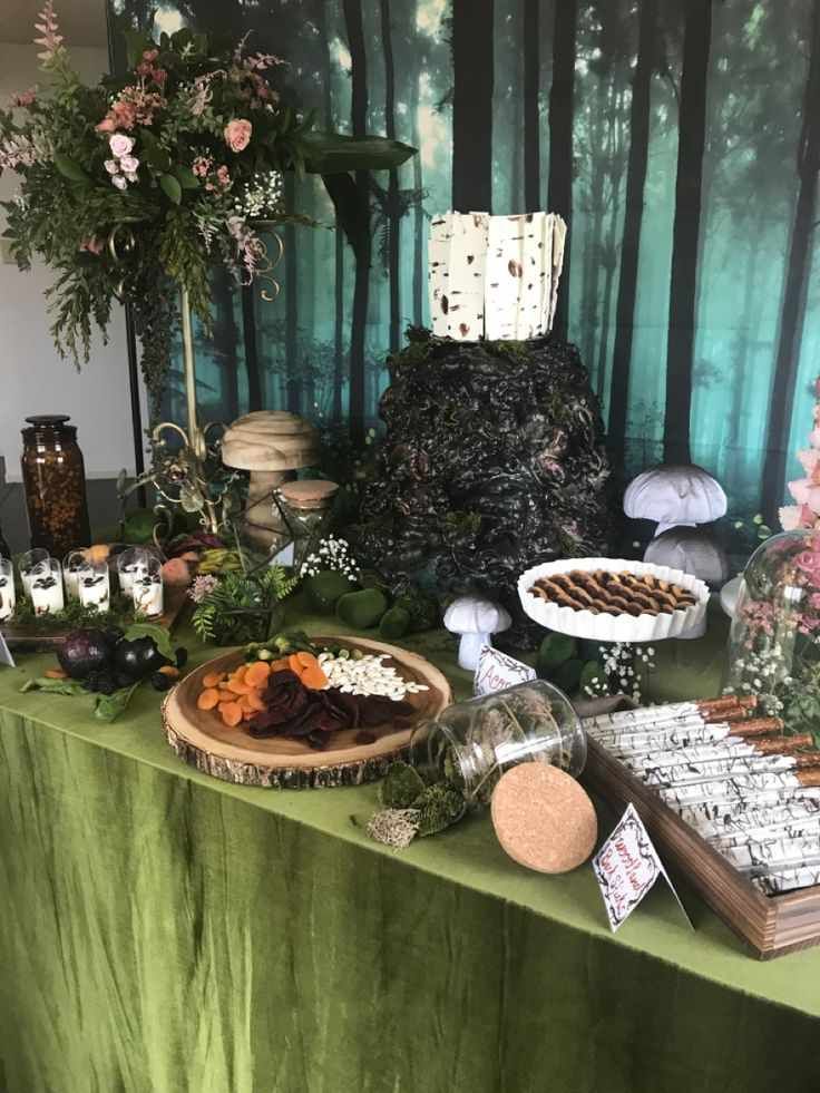 Dessert station with moss runner, pinecone bowls, chocolate truffles, berry compote, soft fairy lighting