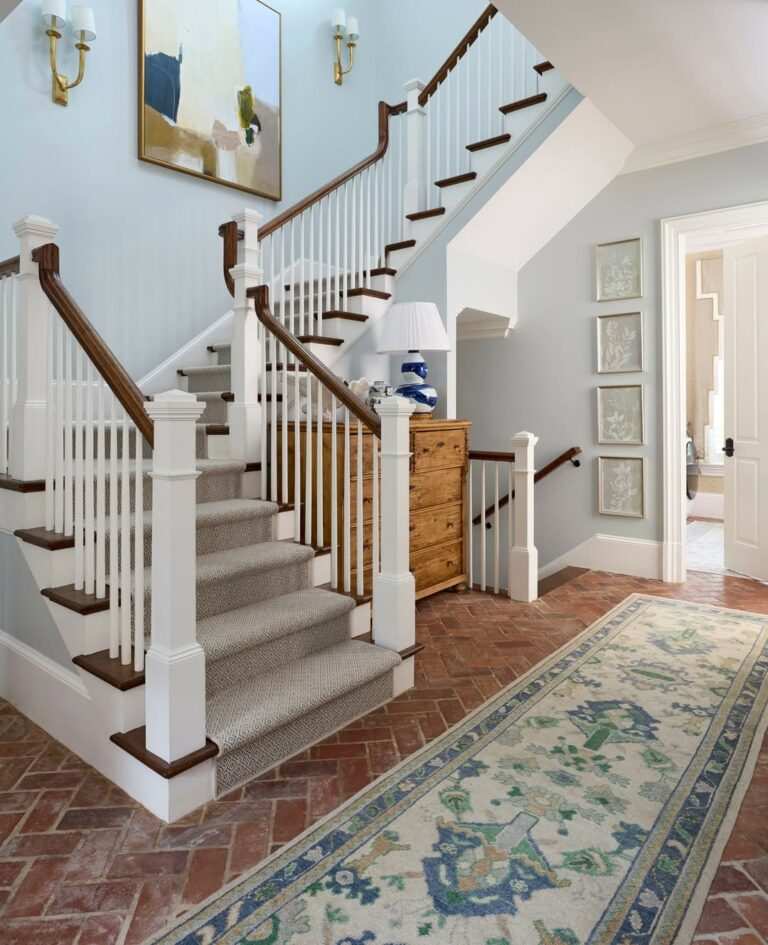 Art Deco staircase with geometric patterns, metallic accents, and bold colors, glamorous style