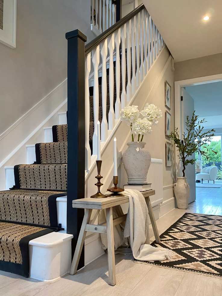 Mid-century modern staircase with clean lines, wood tones, and modern art, retro chic