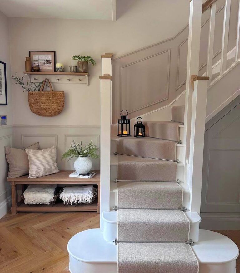 Traditional staircase with ornate banister, dark wood, and classic art, formal and elegant